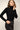 Body col roulé Maxime noir en micromodal porté avec un jean noir taille haute – yvo et moi