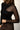 Détail de la découpe asymétrique en tulle sur le devant du sous-pull Pierre noir en mérinos et soie – yvo et moi