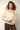 Sous-pull Chouchou écru en mérinos et soie, dentelle au col et aux poignets, porté sous un pull col V – yvo et moi